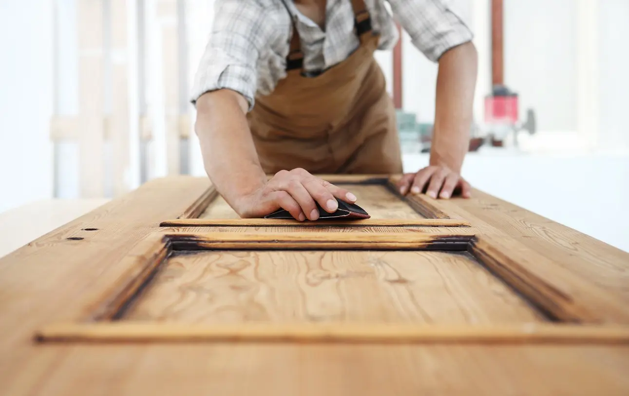 Old wooden door being sanded