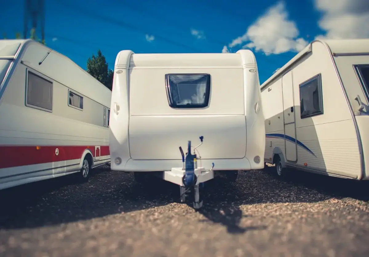 Campers and RVs parked in a row.