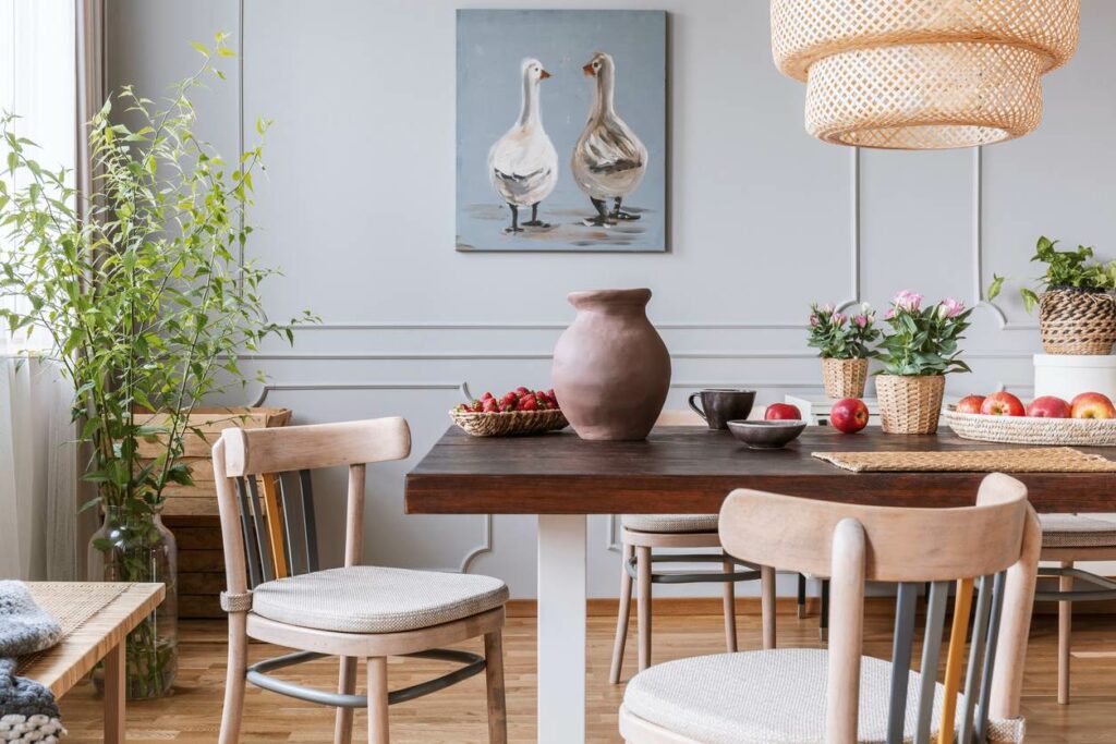 Wooden tables, wooden chairs, and other pieces of wooden furniture in a white room.