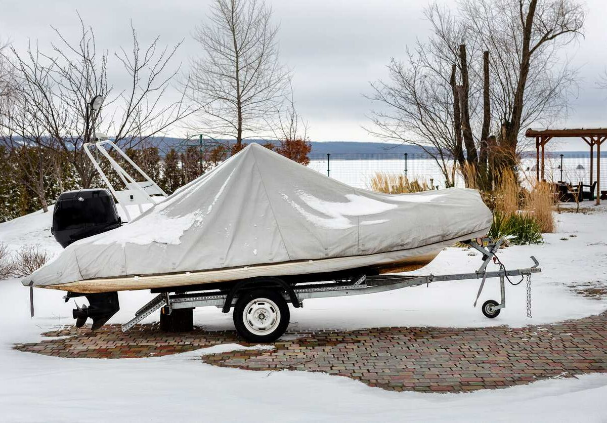 A fishing boat is wrapped in a protective cover for the winter.