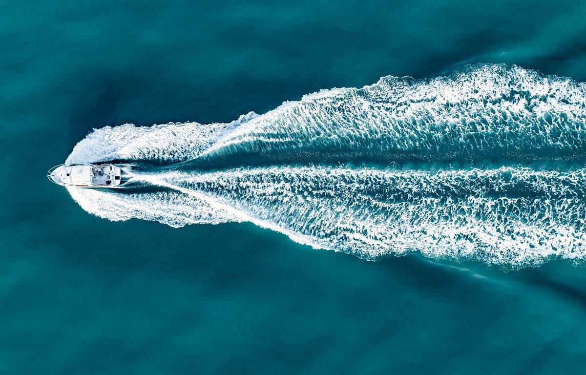 Aerial view of a boat sailing in the sea.